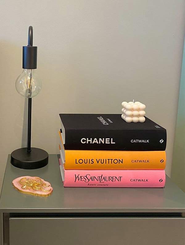 SkinnydipLondon_YvesSaintLaurentCatwalkBook_773x1024_03_600x.jpeg coffee table books on table with lamp - gifts for uni students