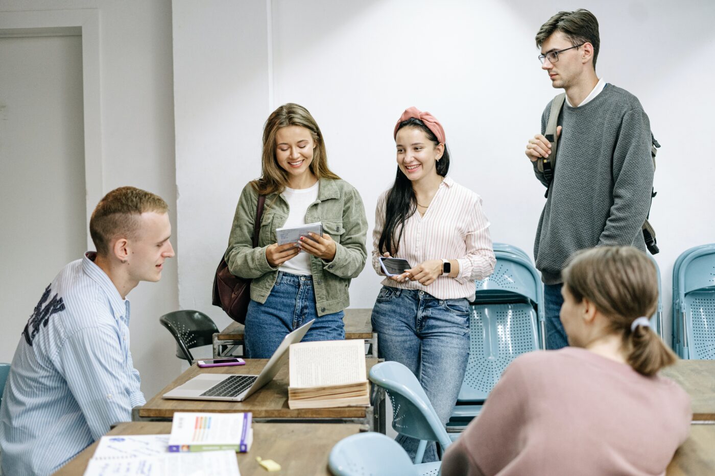 pexels-ivan-samkov-5676744.jpg Uni students hanging out in the lecture hall