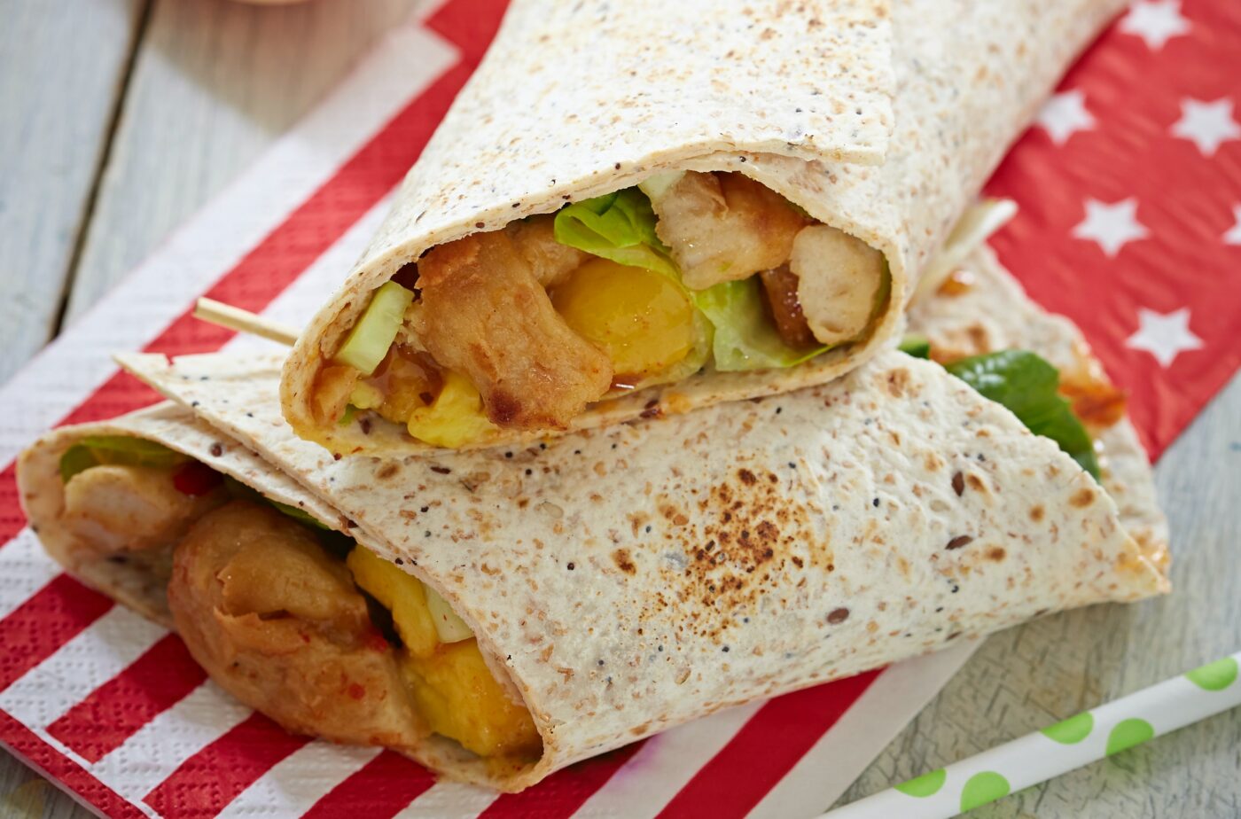 chicken and avocado wrap on serviette. easy student meals for one